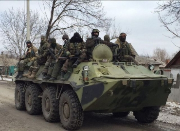 Боевики на БТР врезались в легковую машину мирного жителя